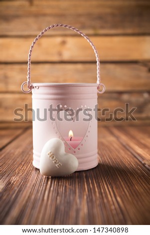 Pink candlestick with heart shape.