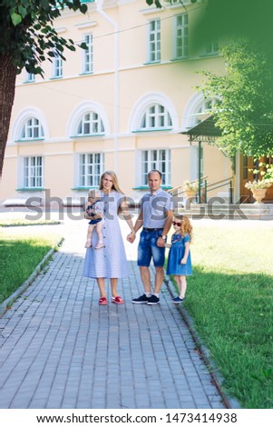 caucasian family walk park, jeans, summer, children