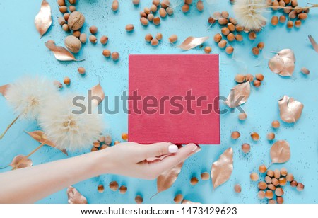 Nature decor,flowers and acorns on blue backgrond. Flat lay, top view.
