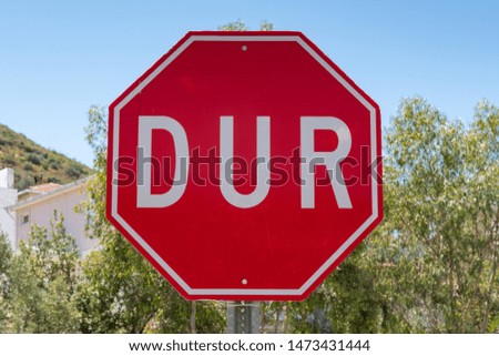 Turkish Stop sign on a street in Foca in Izmir province in Turkey. DUR is the Turkish word for stop.