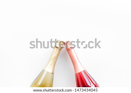Champagne bottle for celebration on white background top view mock up