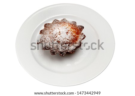 Tasty cupcake on a plate on a white isolated background
