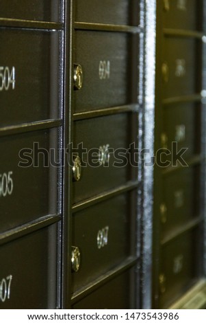 General modern metal mailboxes in a common condominium apartment with an apartment of total area, close-up, with a small blurred depth of field. Concept, postal service.