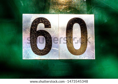 House number 60 on a green front door