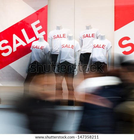 window display with text SALE in a shop.