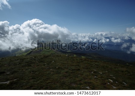 view from the top of the mountain to the old-fashioned mountains and beautiful clouds