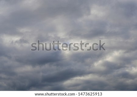 Zoom into the  overcast sky