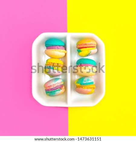Macaroons set on colored background. Flat lay food design