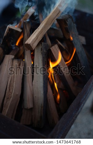 firewood is burning in a barbecue