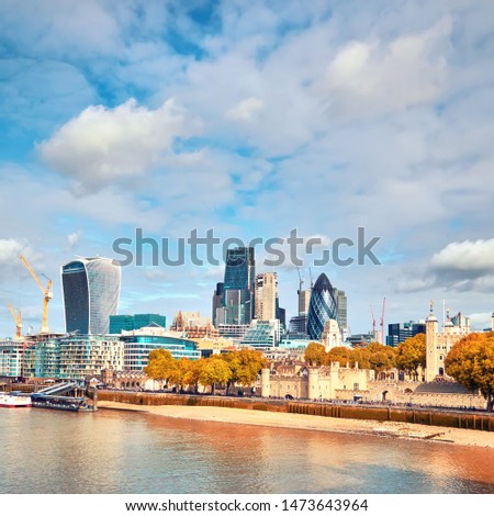 London, South Bank Of The Thames on a bright day in Autumn. This image has been taken from the Tower bridge.