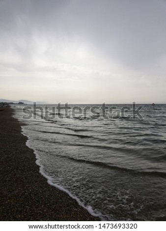 A picture of the sea in a cloudy day.