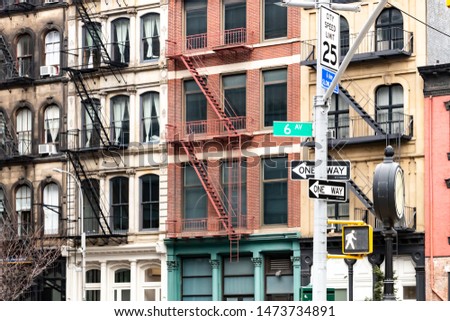 Block of colorful old apartment buildings on 6th Avenue in the Tribeca neighborhood of New York City NYC