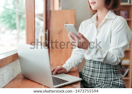 Woman working in cafe  