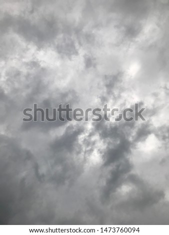 The dark sky and gray background