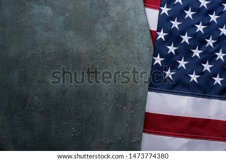 US Flag of United States of America USA with embroidered stars on table top view copy-space.
