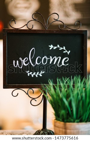 A welcome sign in a coffee shop