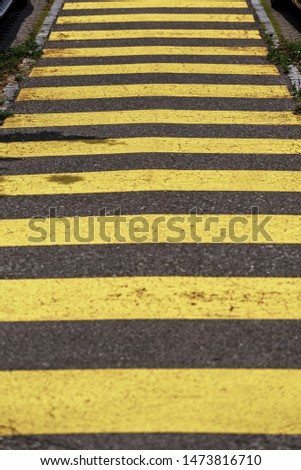 Crosswalk yellow lines on the road. zebra yellow pedestrian crossing