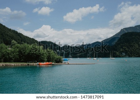 Deep blue Austrian lake with boats 