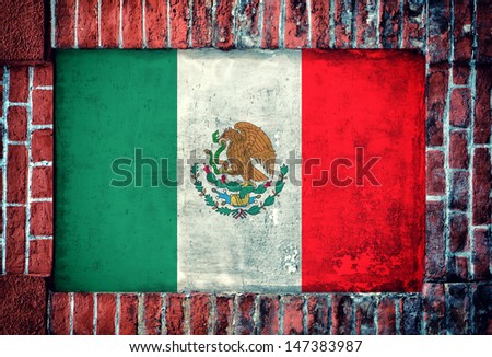 Mexican flag in the old bricks wall