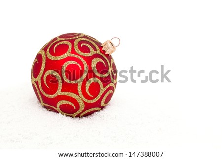 Red Christmas ball on snow