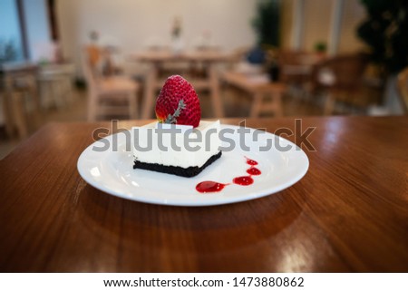  Cheesecake  with  fresh strawberry on white dish.