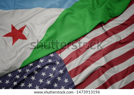 waving colorful flag of united states of america and national flag of djibouti. macro