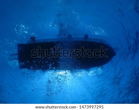 The boat seen from below underwater in Cozumel Island. 