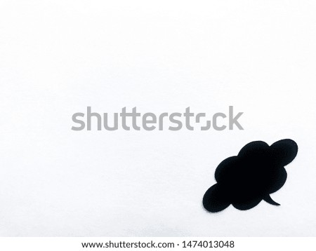 Black cloud speech in the lower right corner, white textured paper background