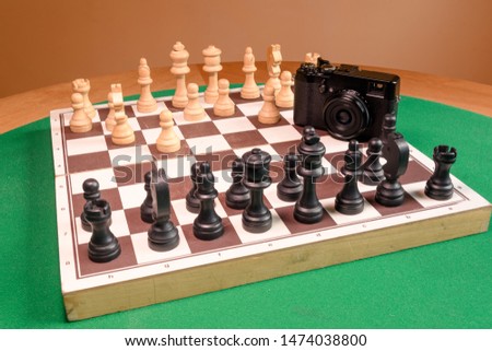 Vintage camera on chess board