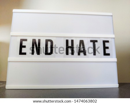 Text in english on lightbox sign spelling End Hate.