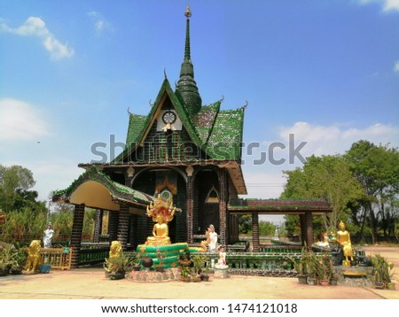 Thailand  Maha Chedi Kaew in Amphoe Khun Han, Sisaket Province, Thailand. Made with all glass bottles  Royalty-Free Stock Photo #1474121018