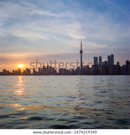 Silhouettes of Toronto skyline at sunset