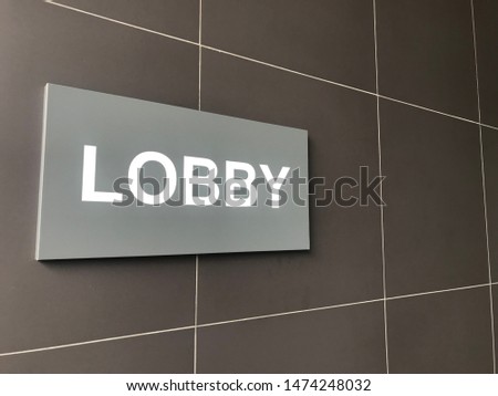 Lobby Signpost on brown background