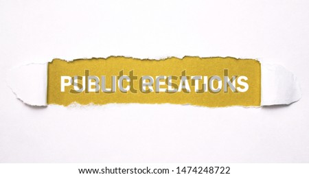 Text Public Relations on torn paper.