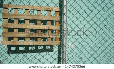 street photography , wooden hanging on steel