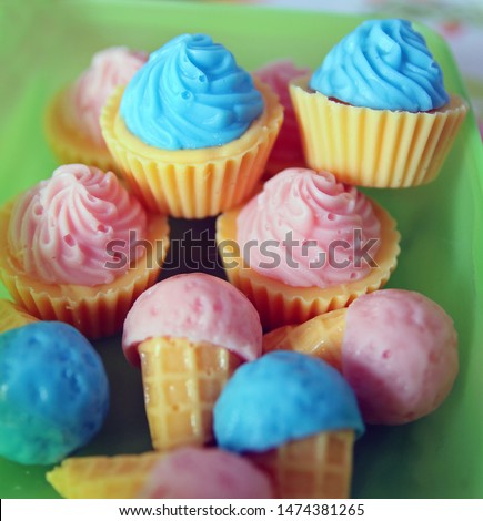 Cute small and colorful little snacks for animals with cupcake and ice cream shape. 