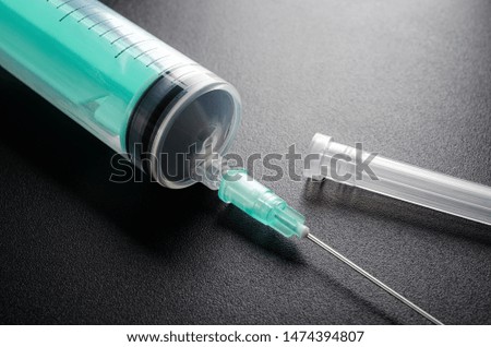Medical syringe closeup with needle