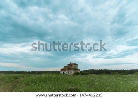 Old abandoned Church in the field in the evening