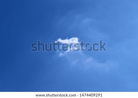 Beaufitul fluffy white clouds on a deep blue summer sky