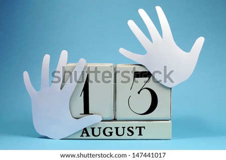 Save the Date calendar for International Left Handers Day on August 13, with with block calendar and left hand cut-outs. Royalty-Free Stock Photo #147441017