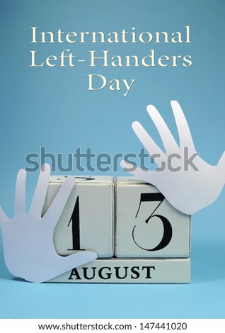 Save the Date calendar for International Left Handers Day on August 13, with with block calendar and left hand cut-outs. Vertical with title text. Royalty-Free Stock Photo #147441020