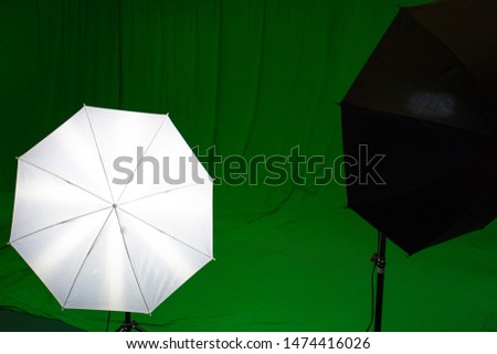 Filmmaking concept. Green screen with lightbox and softbox. Film studio with green screen backdrop.