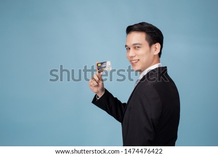 Credit card  Asian man happy financial professional have blue background 