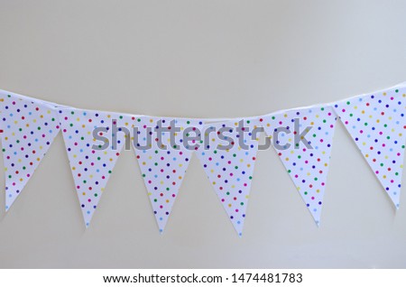 birthday flag with colourful polka dot print on white background : image