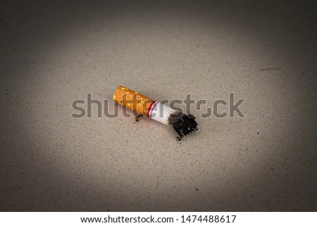 World No Tobacco Day; Smoking cigarettes and laying them on the floor with space for text.