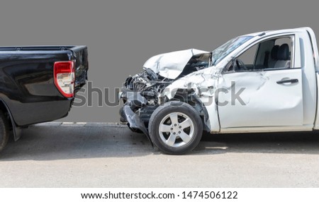 Front White color pack up car crash with back side black color car get damaged by accident on road. Save with clipping path.