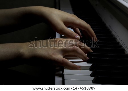 Hands playing piano, close up. The musician plays the piano. Music concept. Picture of wallpaper