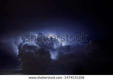 Thunderstorm. Picture of clouds illuminated, light in the sky. 