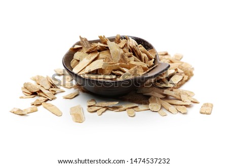 Chinese Herbal medicine - Astragalus slices, Huang Qi (Astragalus propinquus) on white background