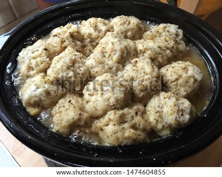 Homemade hearty stew with dumplings in slow cooker picture